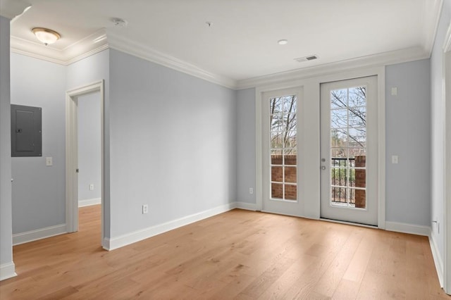 interior space featuring electric panel, baseboards, visible vents, wood finished floors, and crown molding