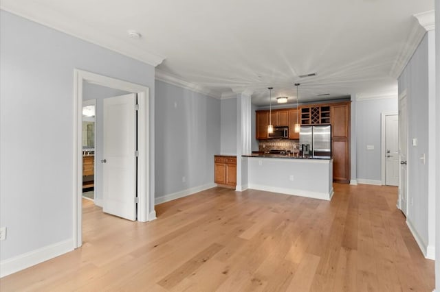 unfurnished living room with baseboards, light wood-style flooring, and crown molding