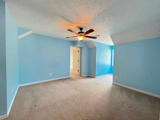 additional living space with baseboards, carpet, and a ceiling fan