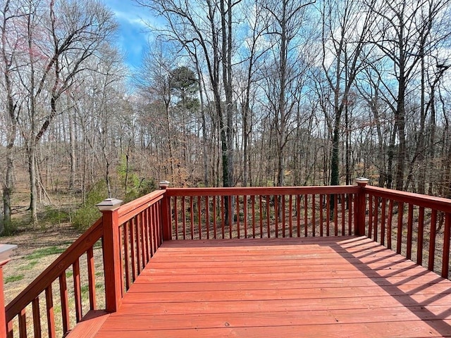 wooden deck featuring a wooded view