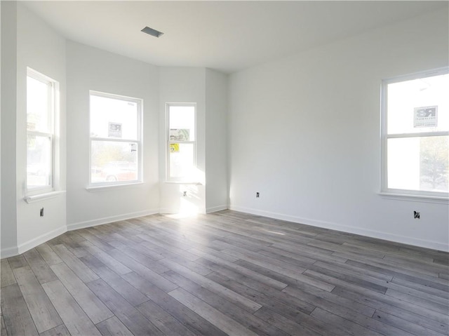 empty room with dark hardwood / wood-style floors