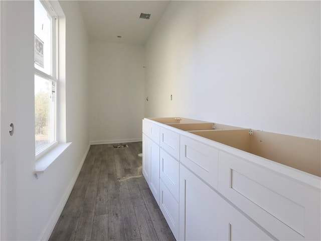 bathroom with hardwood / wood-style floors