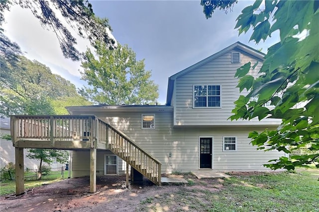 1011 Darvin Ln NW, Kennesaw, GA 30144 - rear view of house featuring a wooden deck, stairway, and a carport