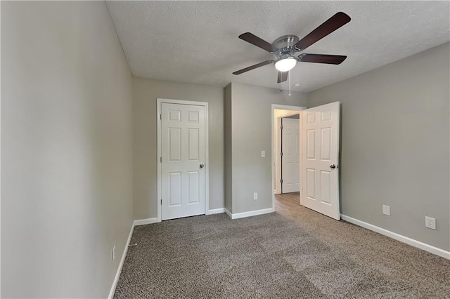 1011 Darvin Ln NW, Kennesaw, GA 30144 - unfurnished bedroom featuring a textured ceiling, carpet floors, and a ceiling fan