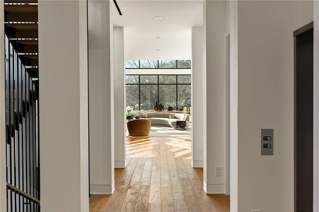 hallway with light wood-type flooring