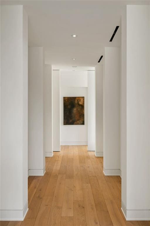 hallway with light wood-type flooring