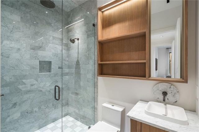 bathroom featuring an enclosed shower, vanity, and toilet