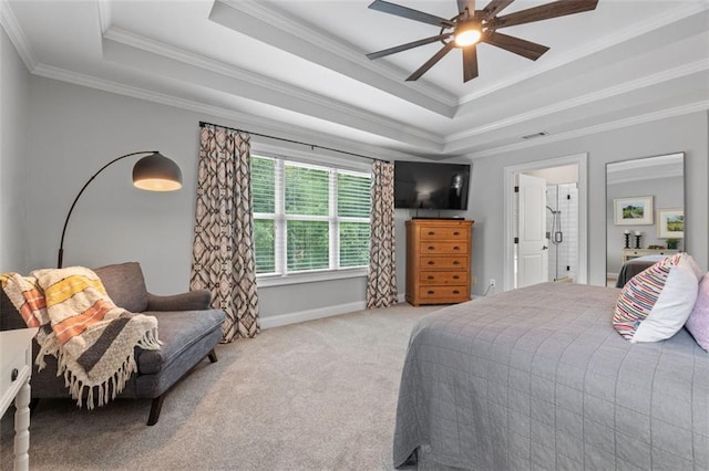 bedroom featuring a tray ceiling, visible vents, light colored carpet, and ornamental molding