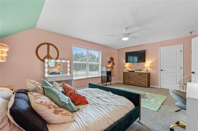 bedroom with baseboards, a ceiling fan, carpet flooring, and vaulted ceiling