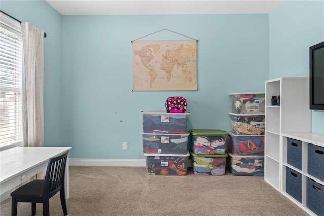 game room with baseboards and carpet flooring