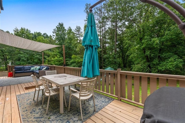 deck with outdoor dining area and outdoor lounge area