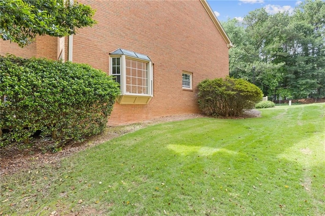 1995 Raleigh Tavern Dr, Roswell, GA 30076 - view of home's exterior with a lawn and brick siding