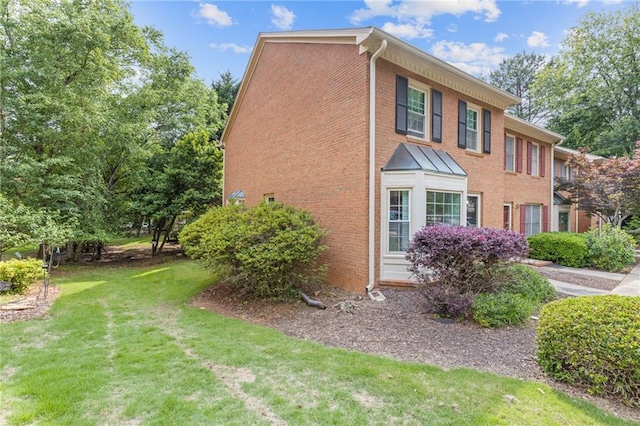 1995 Raleigh Tavern Dr, Roswell, GA 30076 - view of side of property with brick siding and a lawn