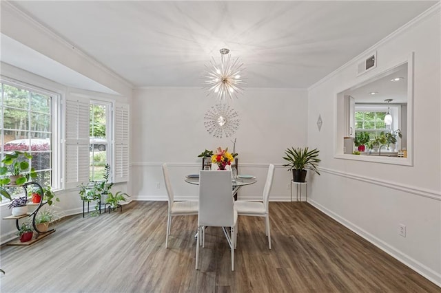 1995 Raleigh Tavern Dr, Roswell, GA 30076 - dining area featuring wood finished floors, crown molding, healthy amount of natural light, and baseboards
