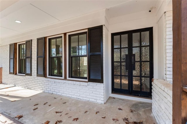 entrance to property with french doors and covered porch