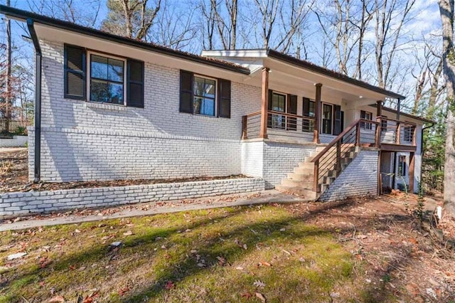 view of front of home featuring covered porch