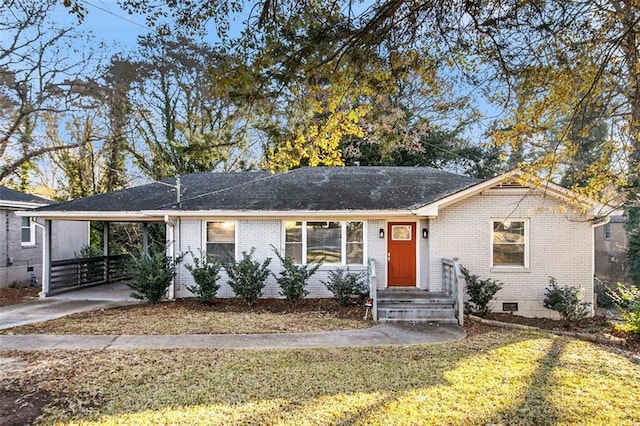 single story home with a front yard and a carport