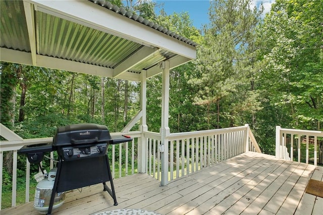 wooden deck with a grill