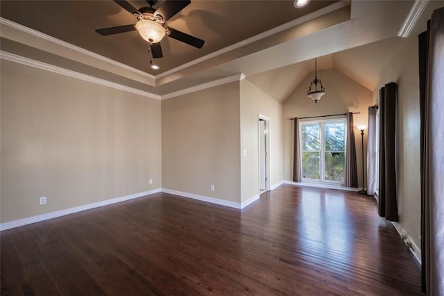 unfurnished room featuring ceiling fan, dark hardwood / wood-style flooring, vaulted ceiling, and crown molding