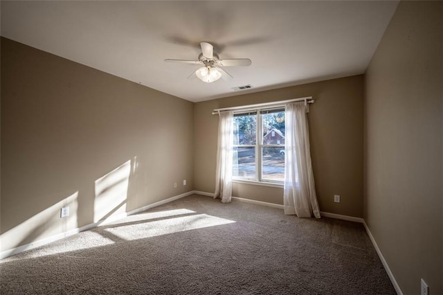 empty room featuring ceiling fan and carpet flooring