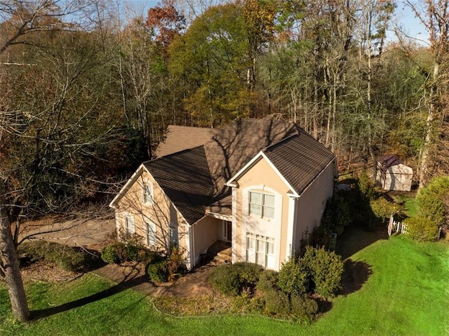 view of home's exterior featuring a yard