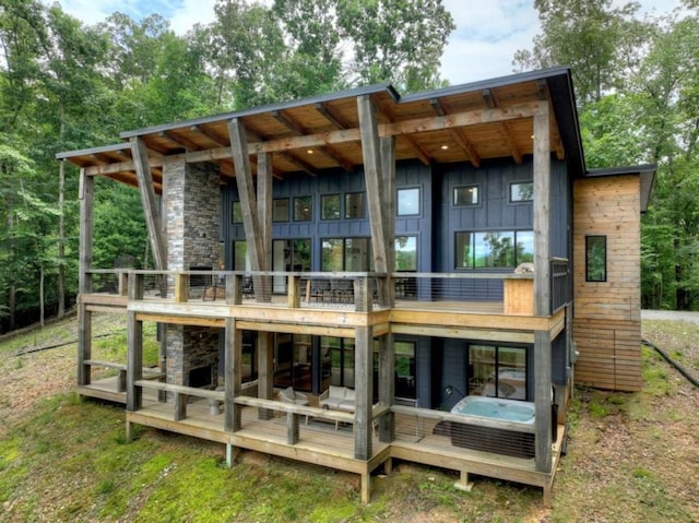 897 Faraday Dr, Ellijay, GA 30540 - back of property featuring board and batten siding, a wooden deck, and stone siding