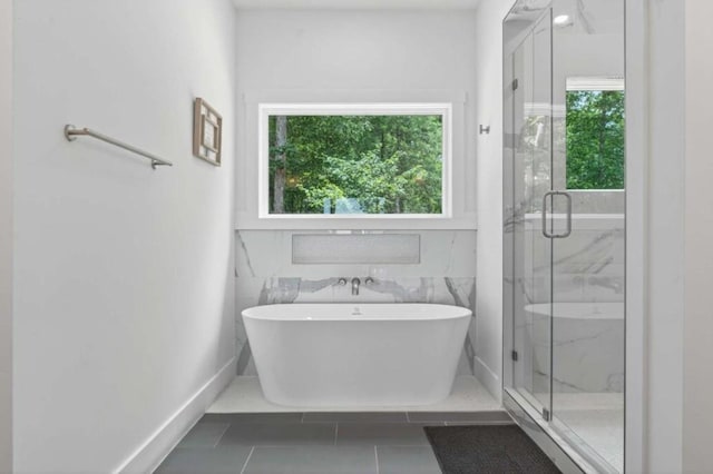 897 Faraday Dr, Ellijay, GA 30540 - bathroom featuring a freestanding tub, a marble finish shower, and tile patterned flooring