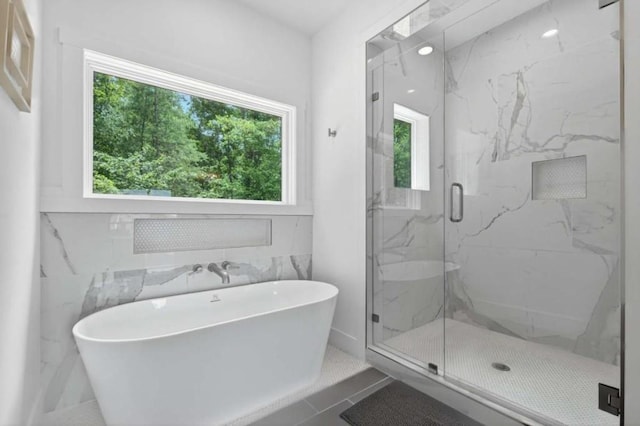 897 Faraday Dr, Ellijay, GA 30540 - bathroom featuring a soaking tub and a marble finish shower