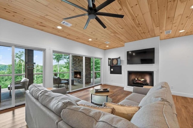 897 Faraday Dr, Ellijay, GA 30540 - living area featuring a lit fireplace, wooden ceiling, recessed lighting, ceiling fan, and wood finished floors