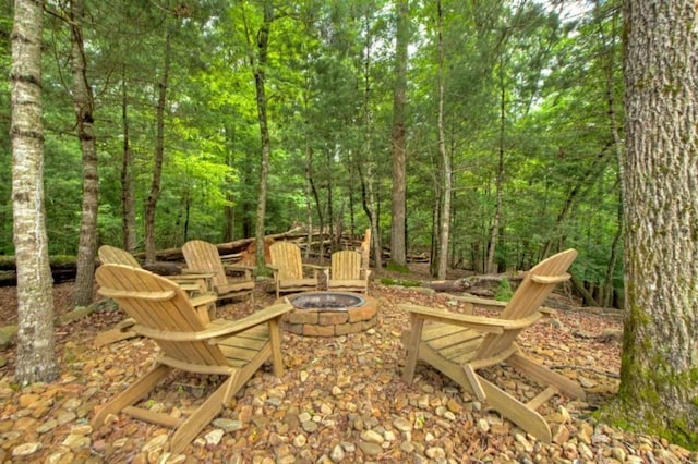 897 Faraday Dr, Ellijay, GA 30540 - view of patio / terrace with an outdoor fire pit and a view of trees