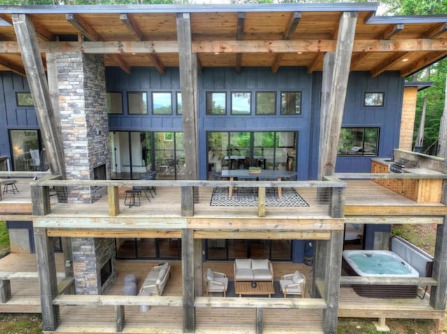 897 Faraday Dr, Ellijay, GA 30540 - rear view of house with board and batten siding and stone siding