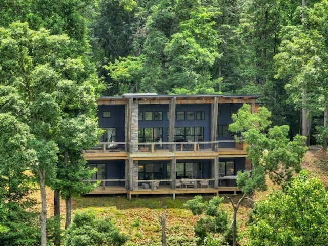 897 Faraday Dr, Ellijay, GA 30540 - back of house with a balcony and a view of trees