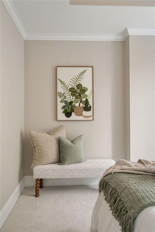 bedroom with ornamental molding, baseboards, and carpet