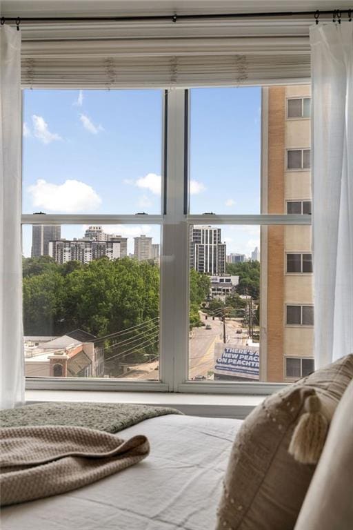 doorway to outside featuring a view of city and plenty of natural light