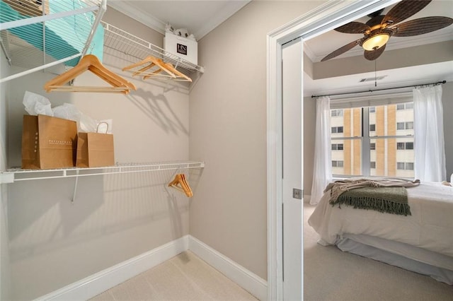 spacious closet with ceiling fan