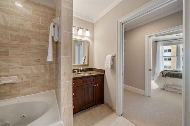 ensuite bathroom featuring crown molding, baseboards, vanity, and tile patterned floors