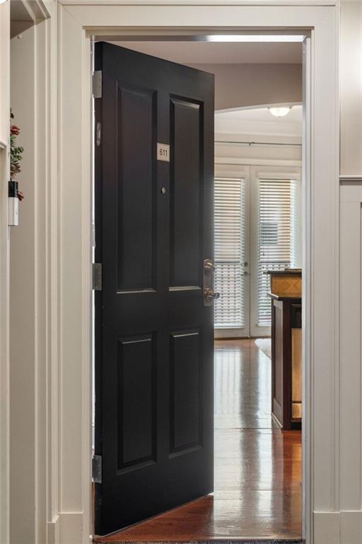 foyer with wood finished floors and french doors