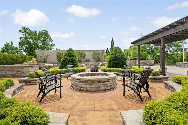 view of patio with an outdoor fire pit and a pergola