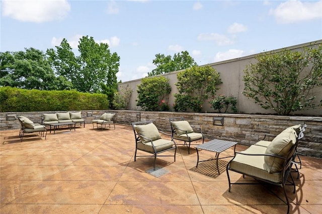view of patio / terrace featuring outdoor lounge area and a fenced backyard