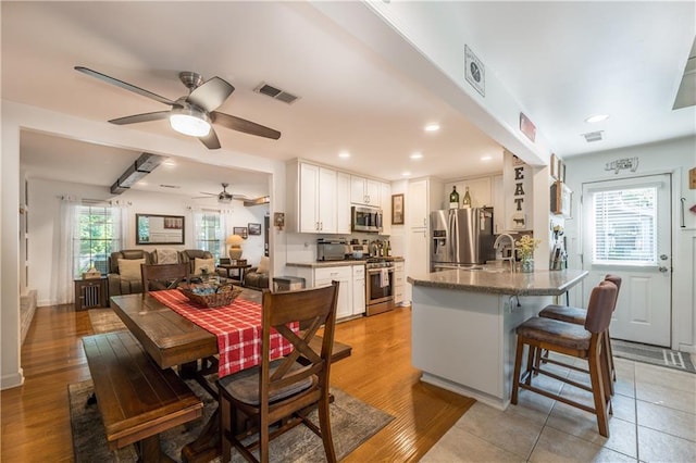 4442 Academy St, Acworth, GA 30101 - dining room with a ceiling fan, light wood finished floors, and recessed lighting