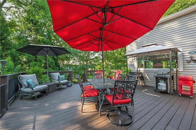 4442 Academy St, Acworth, GA 30101 - wooden deck with grilling area, a gazebo, outdoor dining area, and an outdoor hangout area