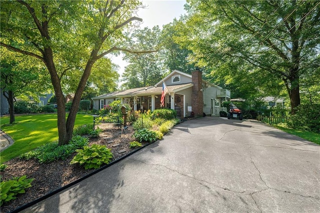 4442 Academy St, Acworth, GA 30101 - view of front of home with driveway, a chimney, and a front yard