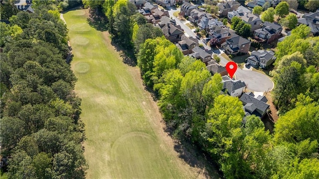 drone / aerial view with a residential view and golf course view