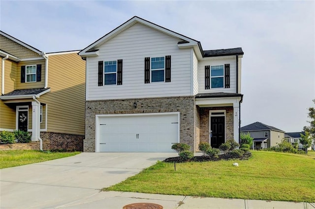 view of front of home featuring a garage, driveway, and a front lawn