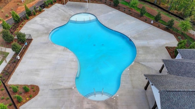 community pool with a patio