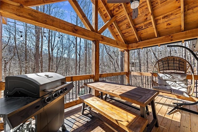 snow covered deck featuring ceiling fan and grilling area