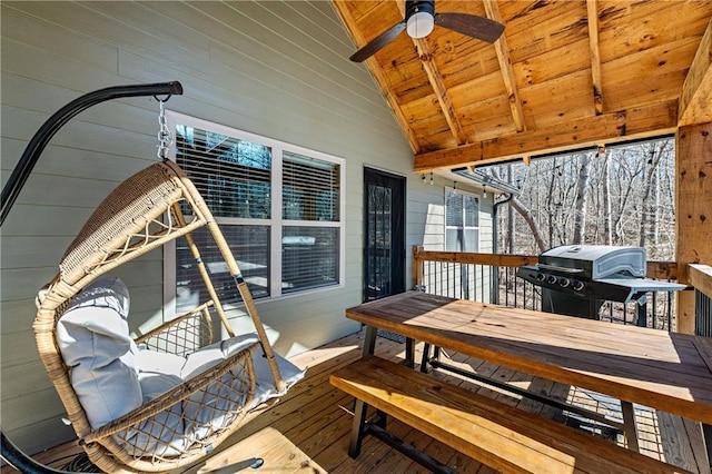 wooden terrace featuring ceiling fan and area for grilling