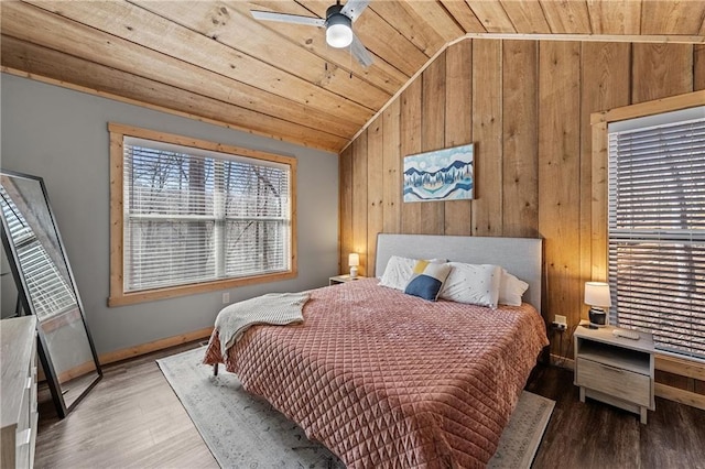 bedroom featuring hardwood / wood-style flooring, wooden walls, lofted ceiling, and wood ceiling