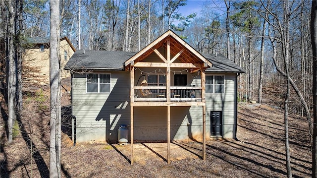 back of house with a balcony