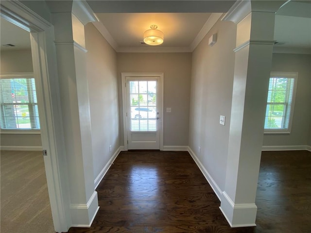 doorway featuring crown molding and dark wood-type flooring